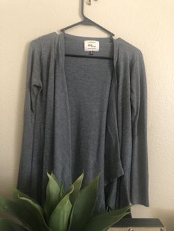Grey cardigan very flare out in back butt area