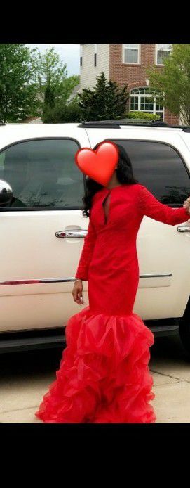 Size 6, red, Gorgeous Mermaid style prom dress with Sexy“peep hole slit in breast area.” Slimming and figure flattering!