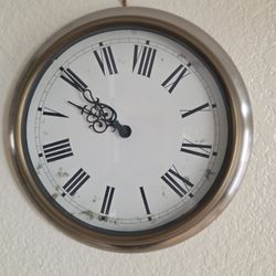 Clock. 12 Inches Across.