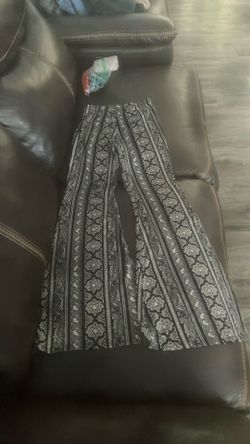 Flared leggings, black and light tanish, cute designs on them, pretty tight