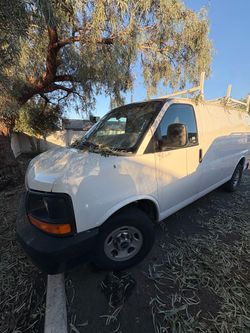GMC Savana White Cargo Van with Roof Rack
