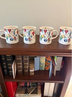 FOUR CHRISTMAS MUGS