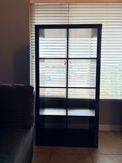 IKEA Kallax shelf unit in brown/black