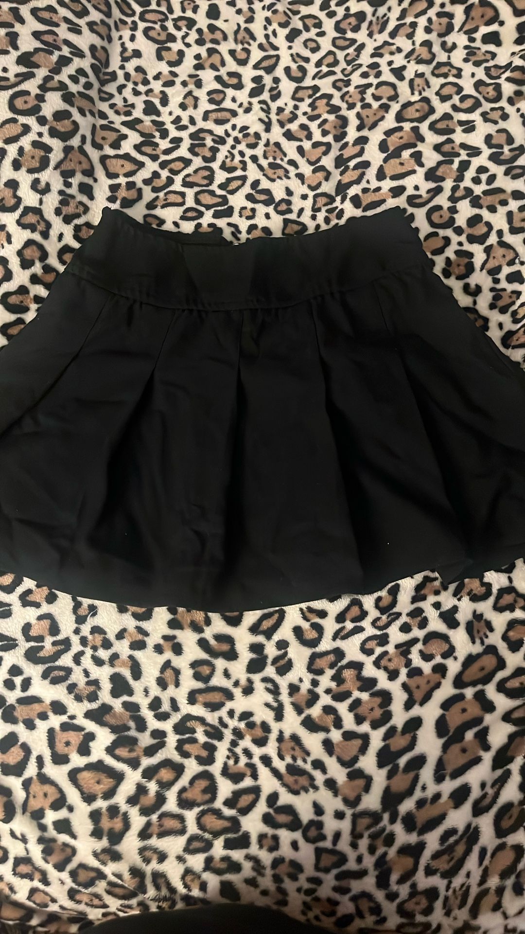 black pleated skirt