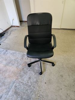 Office chair - height adjustable, rolls, and swivels