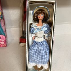 1997 Mattel Little Debbie Barbie Collector's Edition Series III doll, number 16352.  The doll wears a blue gingham dress, a straw hat with a blue band