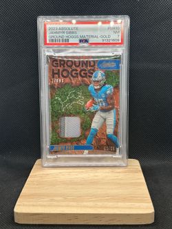 2023 Panini Absolute Ground Hoggs Materials GH10 Jahmyr Gibbs /99 PSA 7 POP 1
