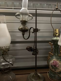 Antique oil lamp converted to electric on adjustable pole
