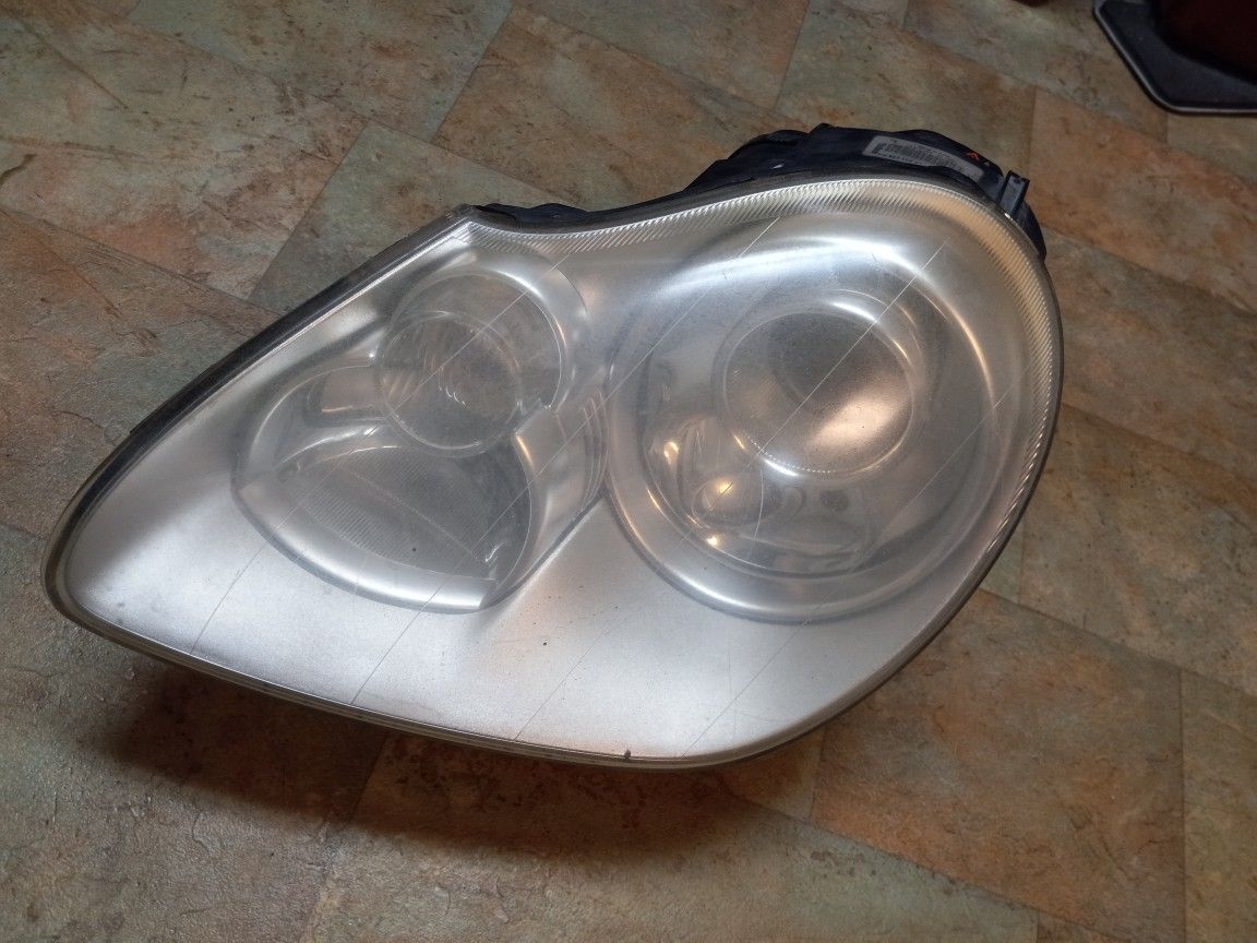 03 05 PORCHES CAYENNE LEFT SIDE HEADLIGHT