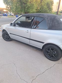 Silver Convertible Car with Black Soft Top