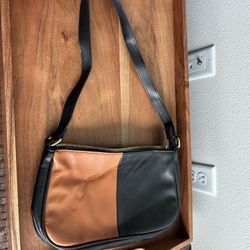 Cute black and tan faux leather bag