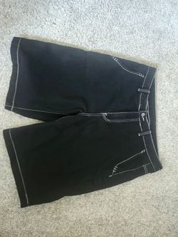 Black jorts with white stitching and design