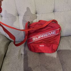 Authentic: limited Supreme red cross body bag.