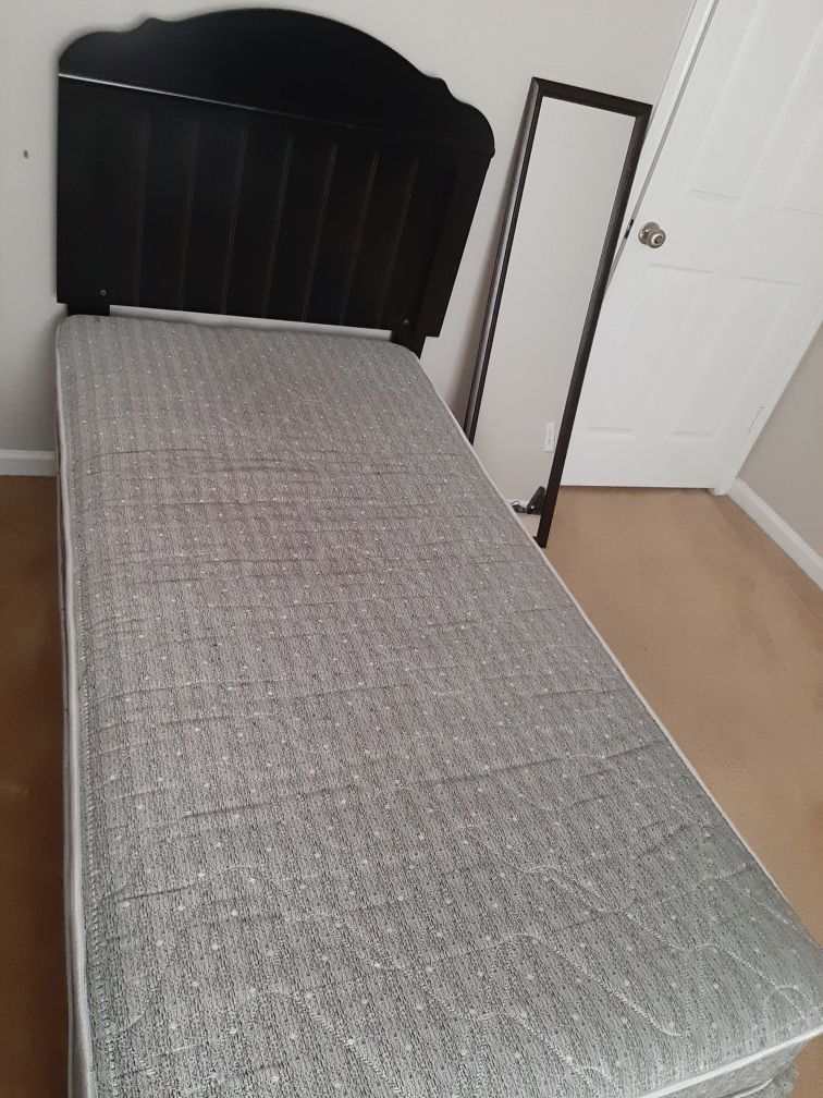 Twin bed frame with mattress.