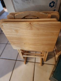 USED SET OF 4 WOOD TV TRAY TABLES AND STAND  I TABLE HAS SOME WEAR