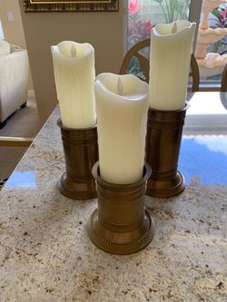 Beautiful 3 tiered candlestick holders. Candles not included. Great for a coffee table or wall unit.