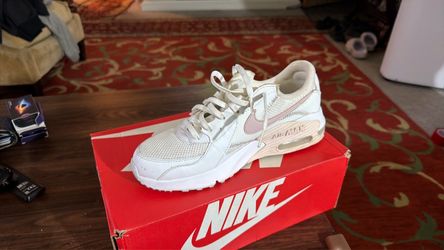 White and Pink Nike shoes