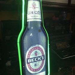 Becks light over 27 inches high by 10”. 75 OBO