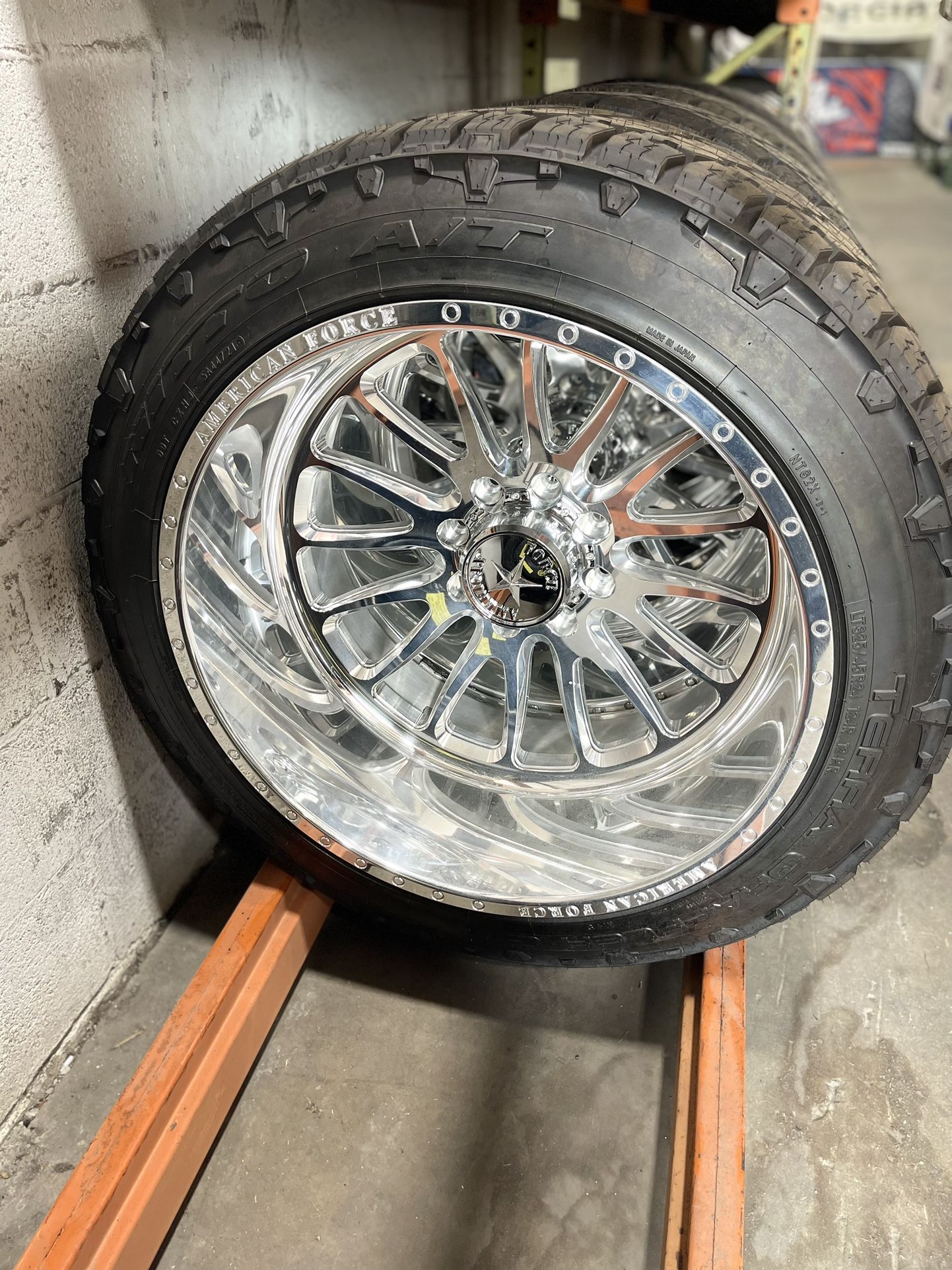 24x14 American Force Nemesis CKH10 Fully Polished Wrapped In 325/45r24 Nitto Terra Grappler G2 Tires