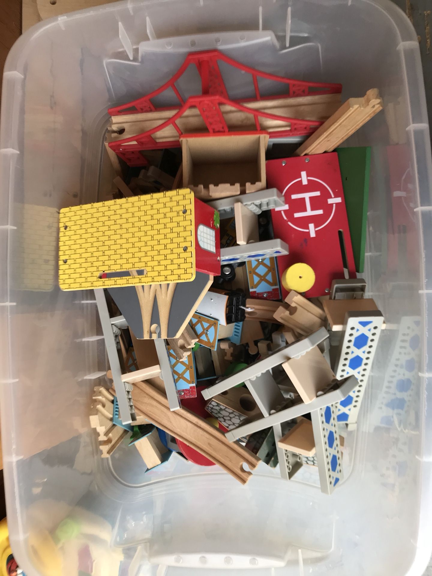 Bin of wooden trains,tracks and accessories