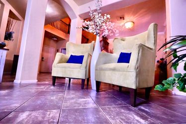 Beautiful set of two green tufted accent chairs in excellent condition