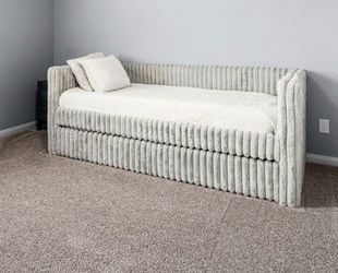 Plush twin bed with trundle