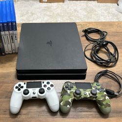 PS4 Slim 1 TB Plus 2 Controls & 12 Games!
