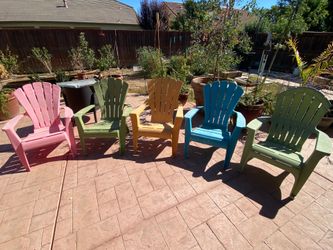 5 plastic Adirondack style chairs