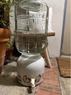 Dispenser and 5 Gallon Glass Water Bottle $75