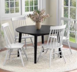 Solid is wood black round table and chairs dining set
