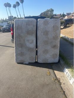 Free 2 used twin mattress beds