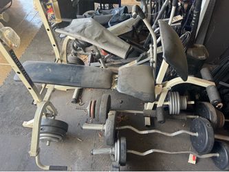 Workout bench with weight and bars-wheel chairs hardly even used