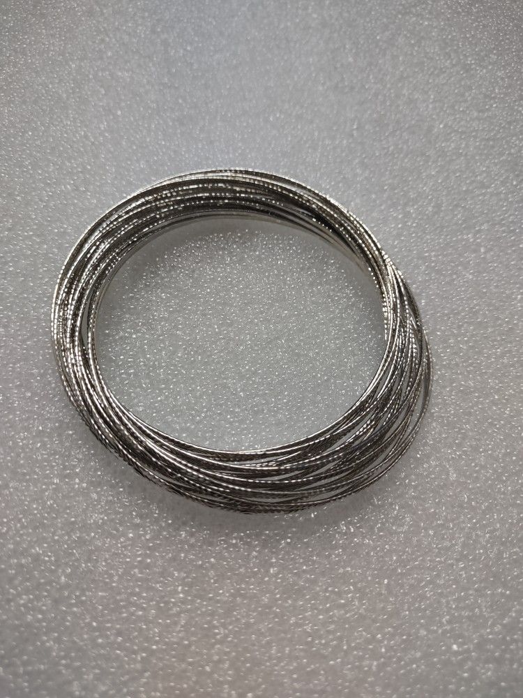 Silver-tone bracelet, 19 intertwined pulses