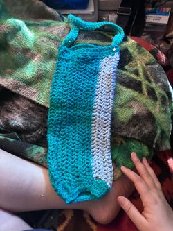 Crocheted potholders as well as a water bottle holder