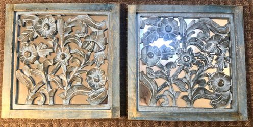 Mirrored pair of decorative wall mounts