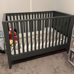 Gray baby crib from Crate & Barrel