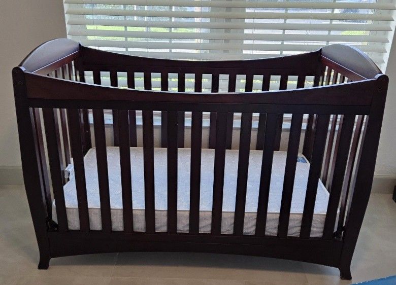 Gently Used Dark Wood Crib, mattress, and mattress cover