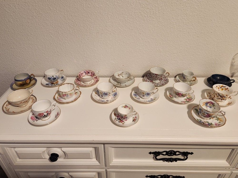 TEA CUPS AND SAUCERS