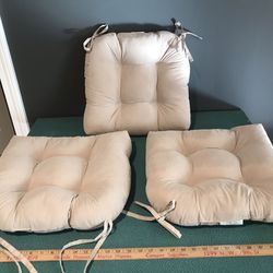 3 tan sueded, tufted chair cushions