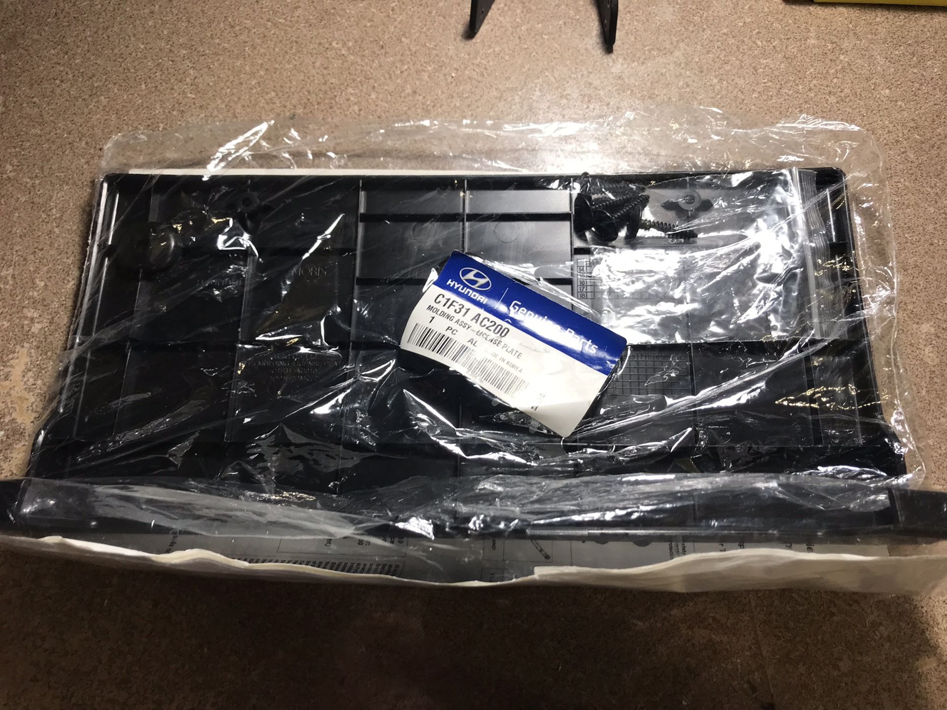 Hyundai Molding Assembly License Plate Holder with the manufacturer part number C1F31 AC200