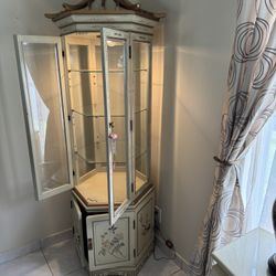Lighted Oriental Octagonal Display Cabinet With Glass Shelves And Storage On The Bottom