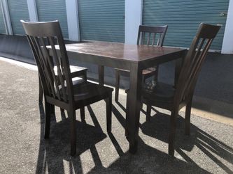 Dark wood dining table w 4 chairs