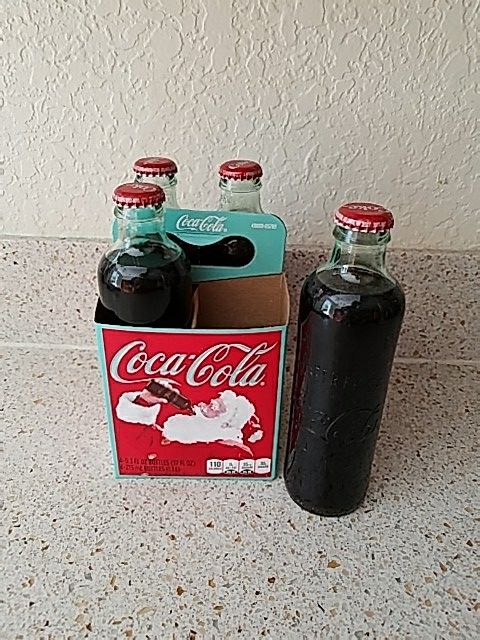 4 collectible coca cola bottles from 2011