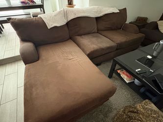 Dark brown couch with chaise lounge and love seat