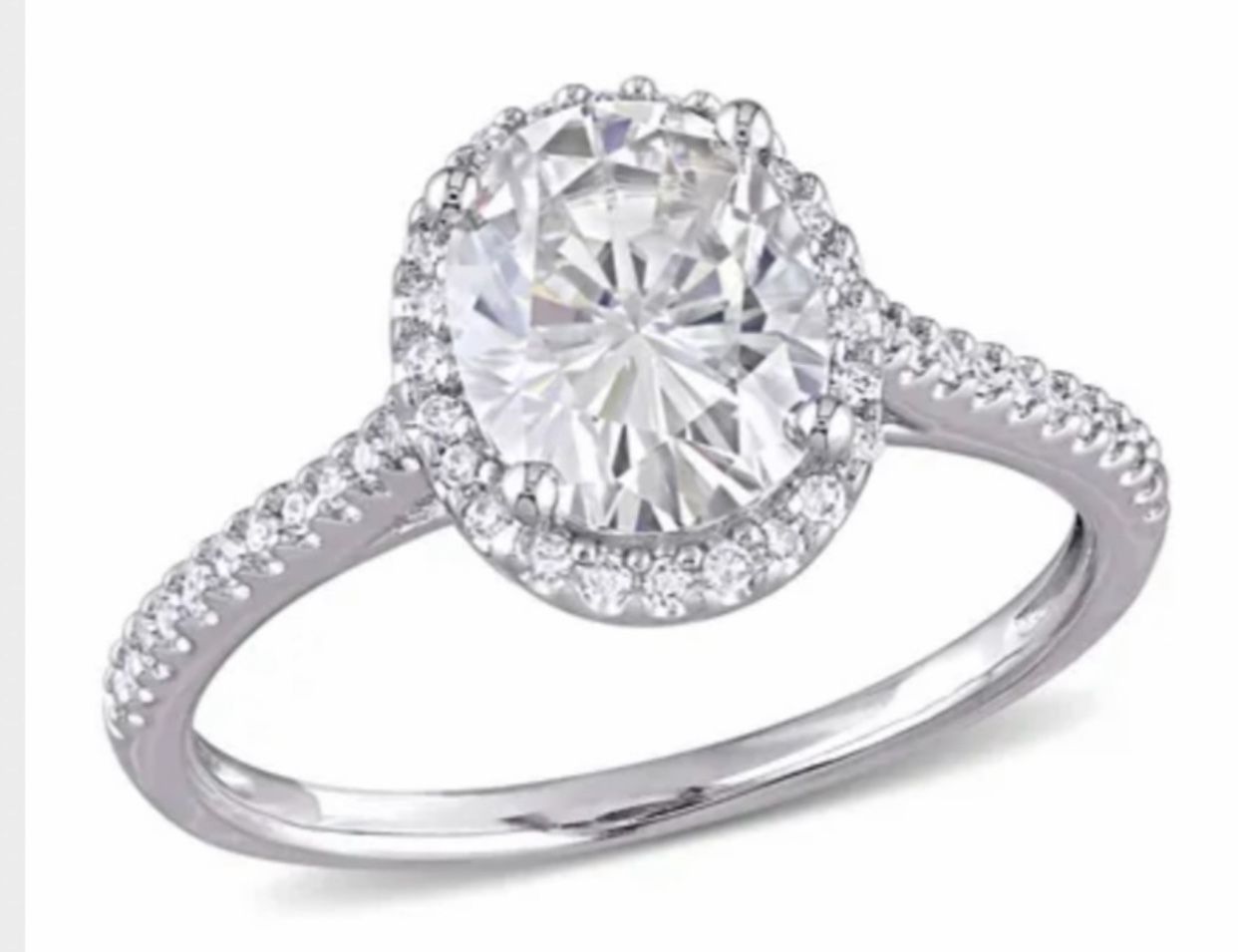 Moissanite and Diamond engagement ring in 14k white gold.