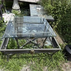 A Metal End Table Or A Squared Coffee Table With Class