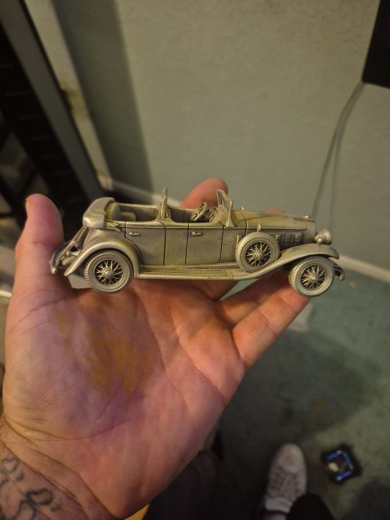 Vintage pewter model of a 1931 Cadillac Phaeton.