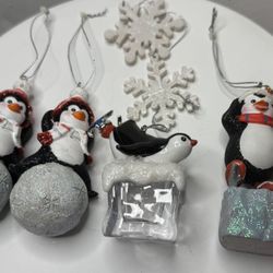 four vintage penguin Christmas ornaments