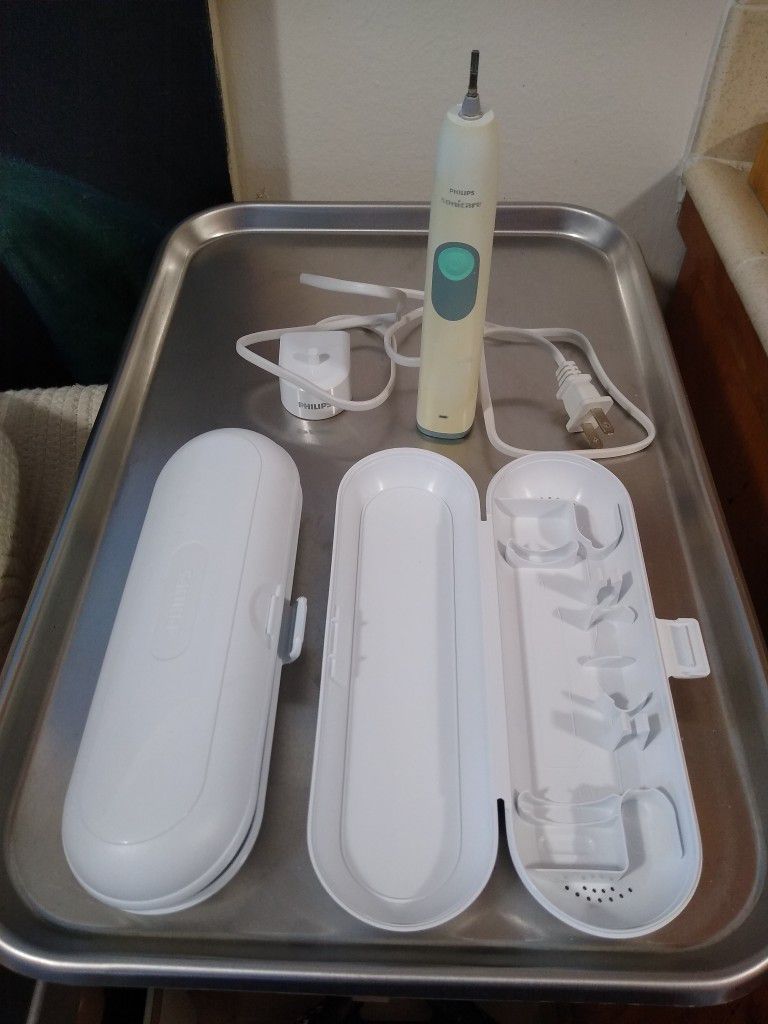 FREE: Sonicare Toothbrush Handle, Charger And Travel Cases