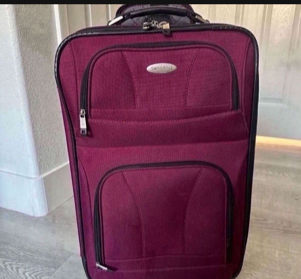 Samsonite carry on luggage size 22’ color dark pink $35